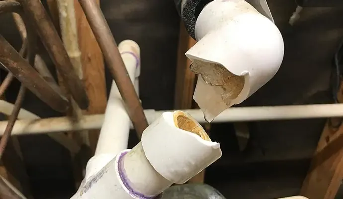 Split and frozen supply pipe that burst during a Texas hard freeze